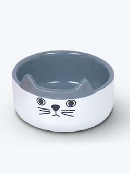 Ceramiczna, biało-szara miska dla kota z printem oczu, nosa i wąsów oraz wystającymi uszkami.
