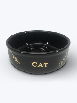 Czarna, głęboka, ceramiczna miska ze złotym napisem CAT oraz rysunkami szkieletów rybek.