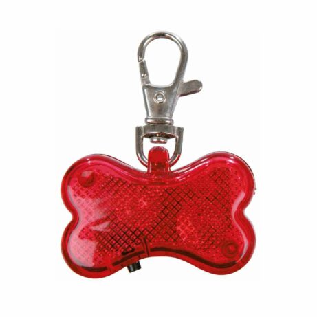 Czerwona lampka sygnalizacyjna w kształcie kości dla psa, z możliwością przypięcia do obroży za pomocą metalowego karabińczyka. Przeznaczona do zwiększenia widoczności podczas spacerów po zmroku. Na jednej stronie lampki znajduje się miejsce na wpisanie danych kontaktowych opiekuna.