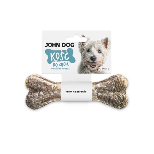 Kość do żucia 12 cm w skórze dorsza w kolorze szarym– widok od przodu. Na środku kości znajduje się biała owijka, do której przymocowana jest biała etykieta z błękitnym napisem. Po prawej na etykiecie jest pies rasy west, który trzyma kość w zębach.