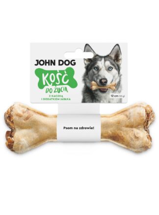 Kość do żucia 12 cm z kaczką z dodatkiem jabłka w kolorze beżowym– widok od przodu. Na środku kości znajduje się biała owijka, do której przymocowana jest biała etykieta z zielonym napisem. Po prawej na etykiecie jest pies rasy husky, który trzyma kość w zębach.