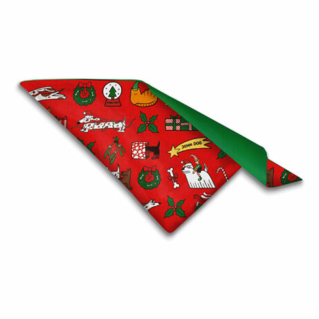 Zdjęcie rozłożonej apaszki dla psa w świąteczny wzór. Dominują kolory czerwony i zielony.