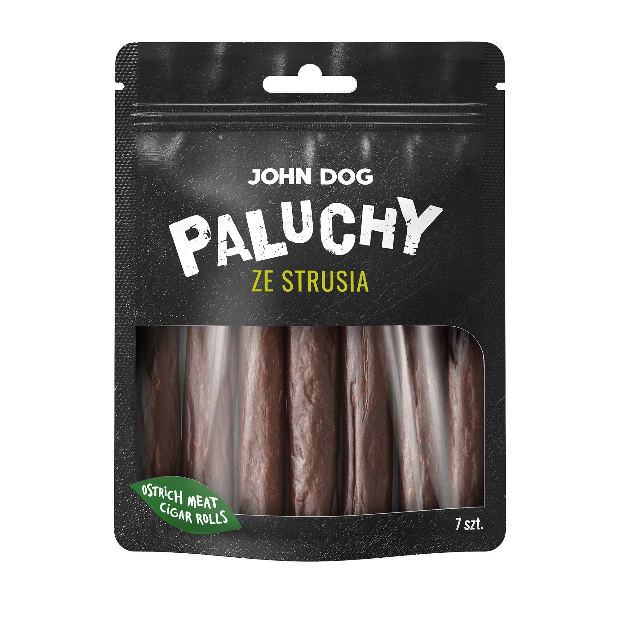 Przysmak dla psa, siedem paluchów ze strusia John Dog w czarnym opakowaniu z transparentną folią na środku przez którą widać produkt. Paluchy są w kolorze brązowym, na etykiecie jest umieszczony zielony listek i żółty napis.