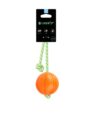 Pomarańczowa piłka o średnicy 7 cm dla psa ze sznurem świecącym w ciemności. Marka Liker Lumi.