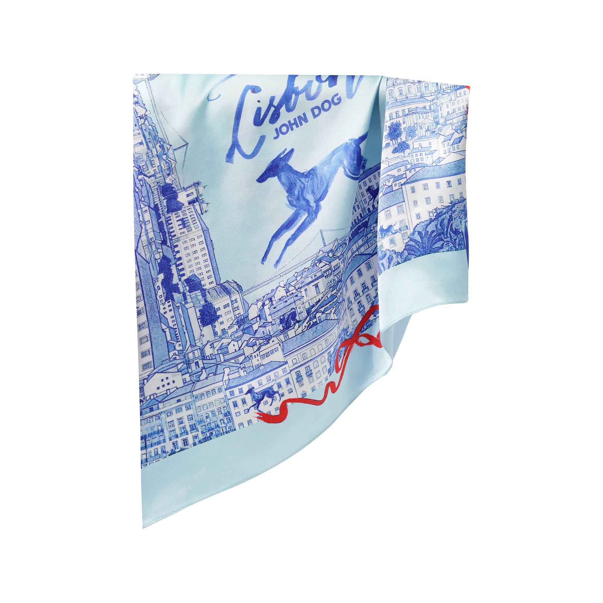 Apaszka John Dog z kolekcji Lizbona w kolorze błękitnym przedstawiająca rysunek granatowego psa rasy chart otoczonego rysunkiem granatowych kamienic i budynków z czerwonymi wstążkami. Na środku jest napis Lisbon, apaszka jest przewieszona i złożona w połowie.