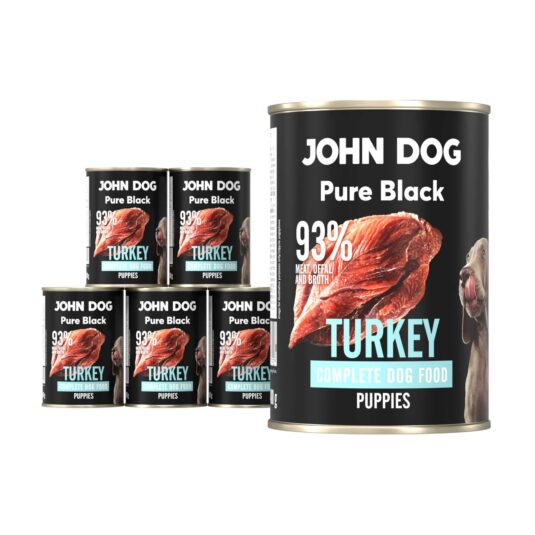Karma mokra dla szczeniąt z indyka John Dog Pure Black w sześciu czarnych puszkach 400g. Na etykietach jest surowe mięso z indyka, zdjęcie psa oraz białe i niebieskie napisy.