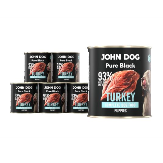 Karma mokra dla szczeniąt z indyka John Dog Pure Black w sześciu czarnych puszkach 800g. Na etykietach jest surowe mięso z indyka, zdjęcie psa oraz białe i niebieskie napisy.
