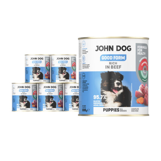 6 puszek mokrej karmy dla szczeniąt John Dog Good Form Rich in Beef Puppies 800 g. Na biało niebieskiej etykiecie znajduje się zdjęcie biało czarnego szczeniaka oraz napisy z informacjami o karmie.