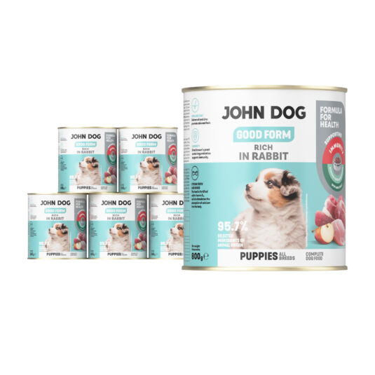 6 puszek mokrej karmy dla szczeniąt John Dog Good Form Rich in Rabbit Puppies 800 g. Na biało błękitnej etykiecie znajduje się zdjęcie szczeniaka oraz napisy z informacjami o karmie.