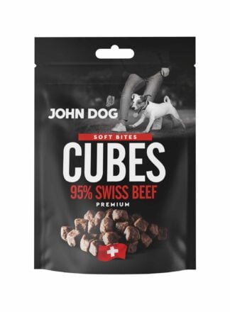 Czarne opakowanie przysmaków dla psów John Dog Cubes Soft Bites Premium-kawałki zawierające 95% mięsa z wołowiny. Na opakowaniu znajduje się zdjęcie psa obok człowieka, grafika suszonych kostek mięsa oraz symbol szwajcarskiej flagi.